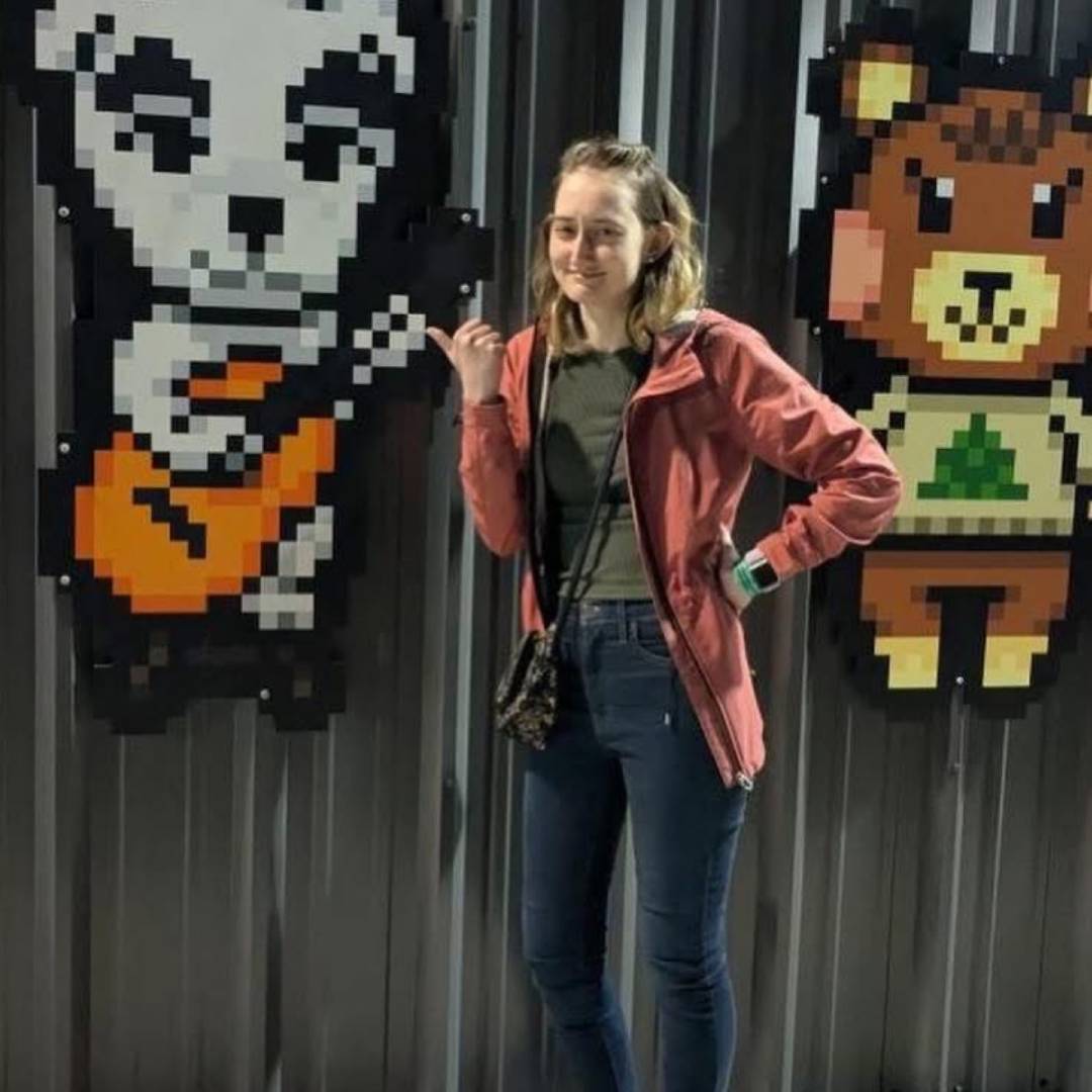 girl standing and smiling